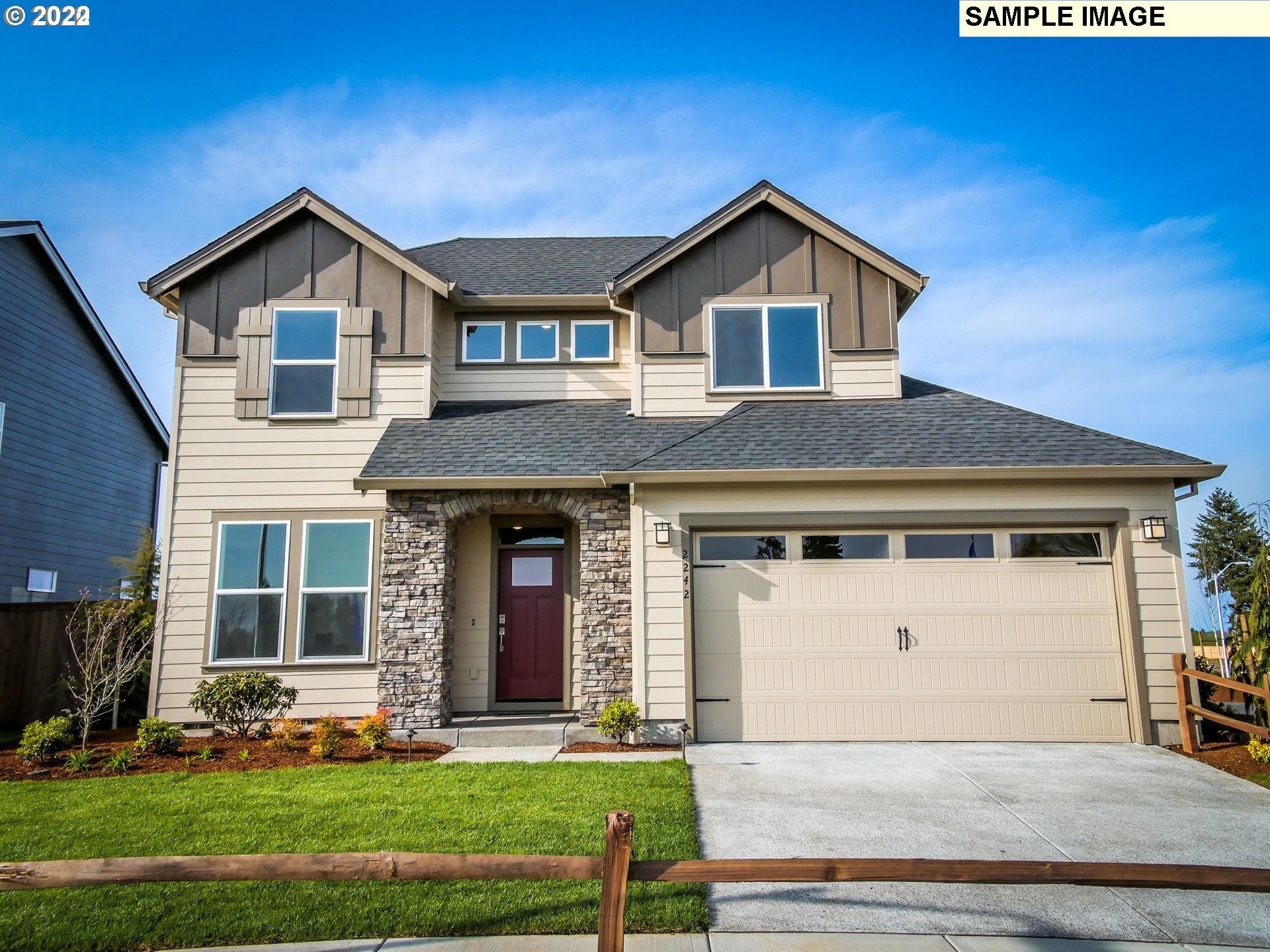 8522 North 5th Street Ridgefield, WA 98642 - Photo 1 of 28 a front view of a house with a yard and garage