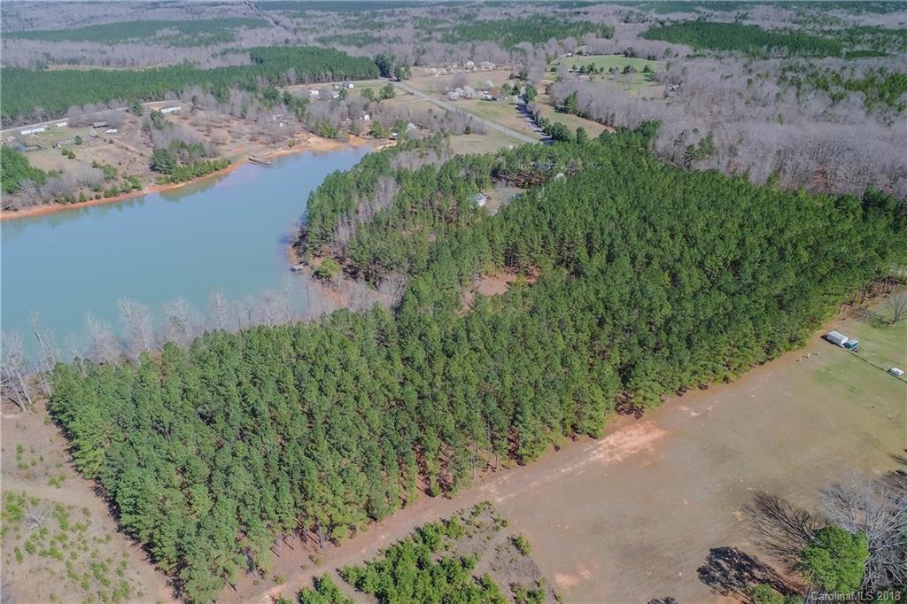 8222 Lockhart Road Sharon, SC 29742 - Photo 4 of 6 a view of a lake with a yard