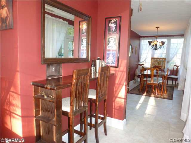 2819 Sherbourne Road North Chesterfield, VA 23237 - Photo 4 of 24 a view of a dining room with furniture and a large window