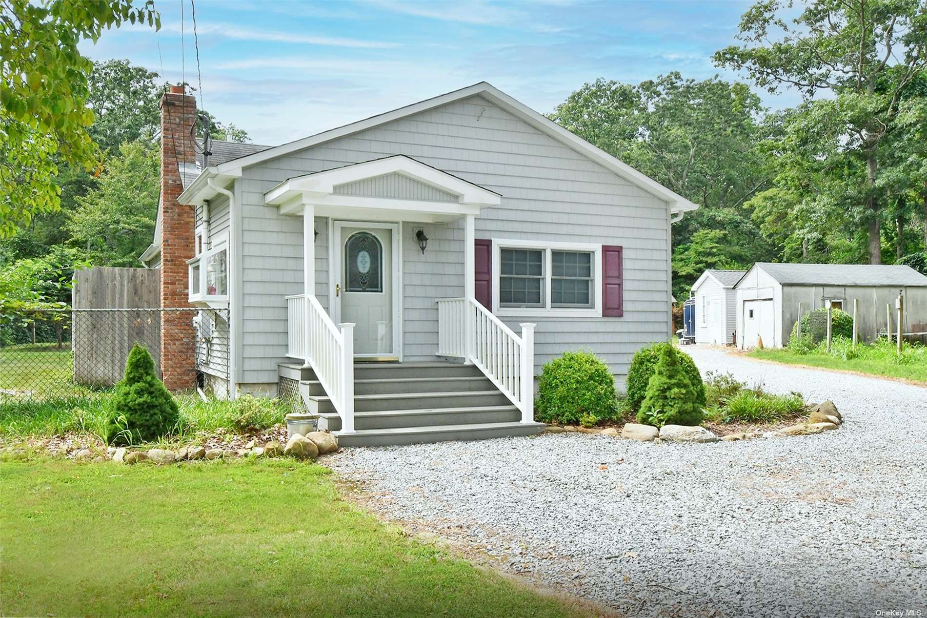 36 Raynor Road Ridge, NY 11961 - Photo 1 of 1 a front view of a house with a yard