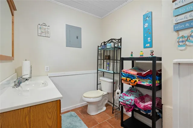 a view of a porch with furniture and wooden floor