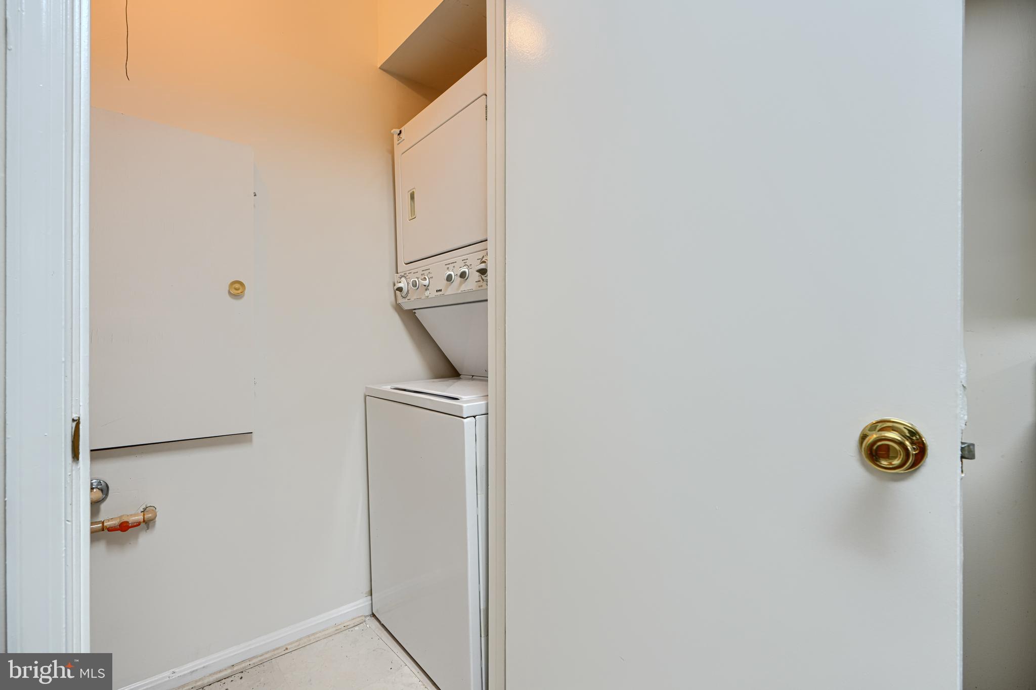 14905 Cleese Court, Unit 5AF Silver Spring, MD 20906 - Photo 13 of 30 a utility room with dryer and washer