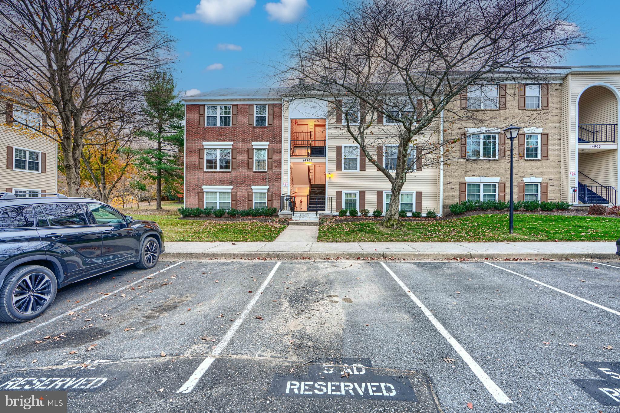 14905 Cleese Court, Unit 5AF Silver Spring, MD 20906 - Photo 27 of 30 a front view of a house with a yard