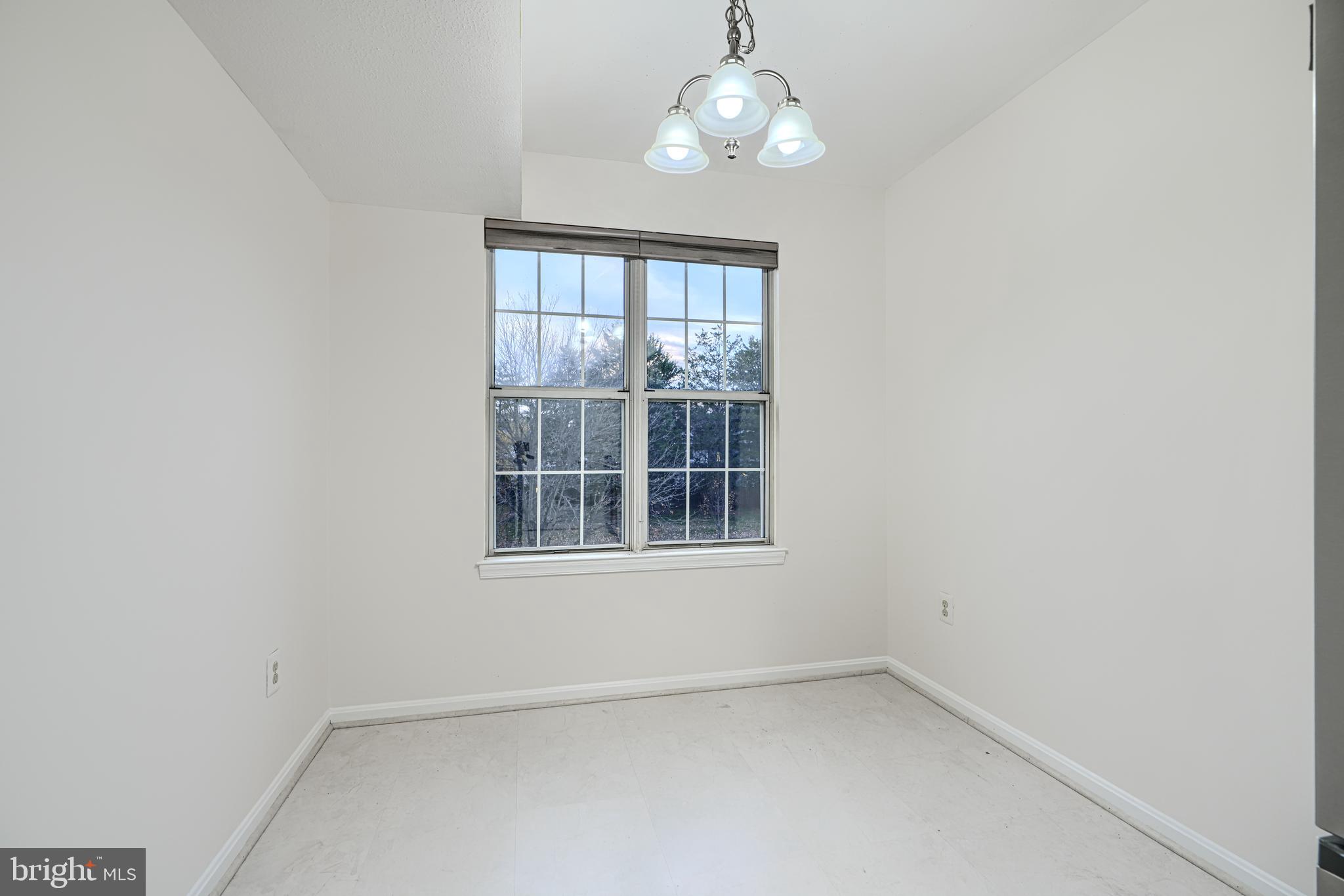 14905 Cleese Court, Unit 5AF Silver Spring, MD 20906 - Photo 8 of 30 an empty room with a window