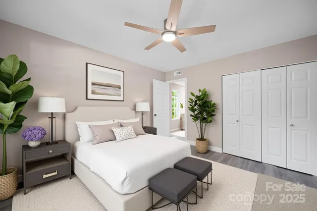 a bedroom with a bed dresser and a window