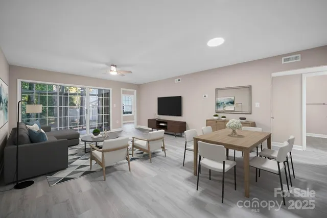a living room with furniture and a flat screen tv