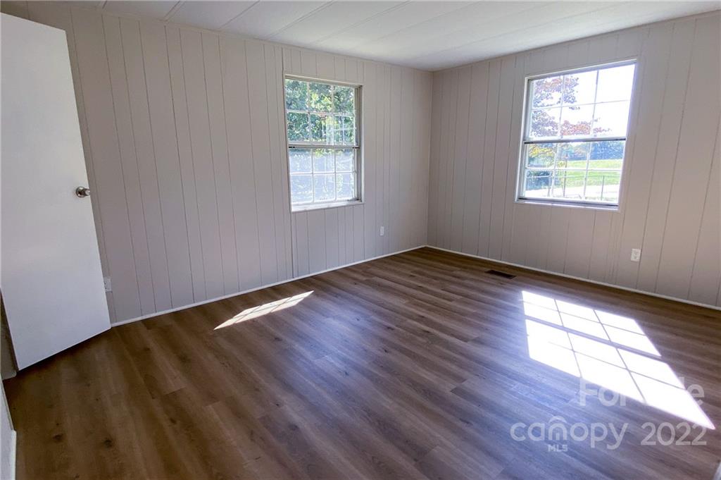 116 Circle Drive Fallston, NC 28090 - Photo 12 of 23 a view of an empty room with wooden floor and a window