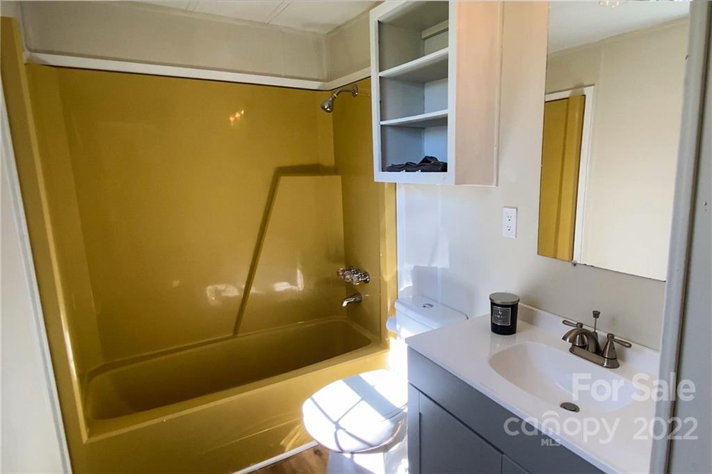 116 Circle Drive Fallston, NC 28090 - Photo 13 of 23 a bathroom with a sink and a mirror