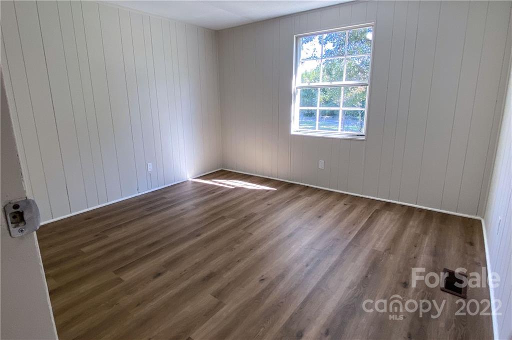 116 Circle Drive Fallston, NC 28090 - Photo 14 of 23 a view of an empty room with wooden floor and a window