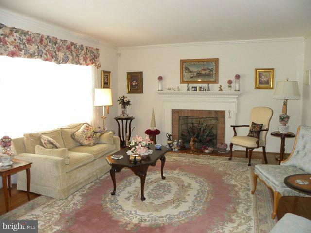 7605 Hayfield Road Alexandria, VA 22315 - Photo 3 of 21 Living Room with Fireplace
