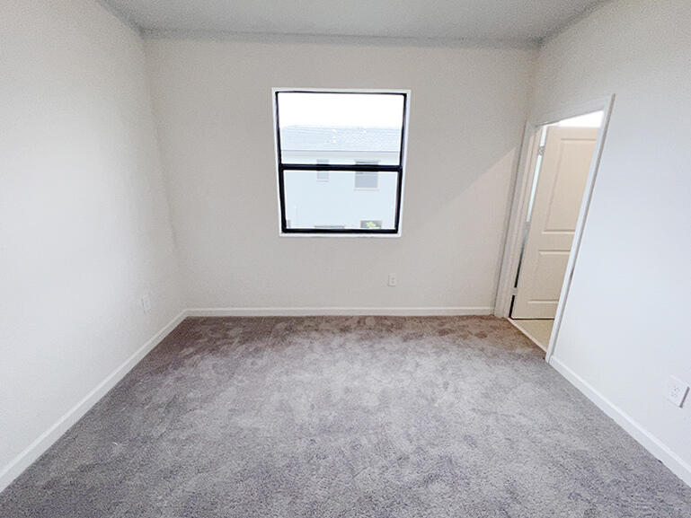 13302 Southwest 286th Street, Unit 13302 Homestead, FL 33033 - Photo 11 of 24 an empty room with a window