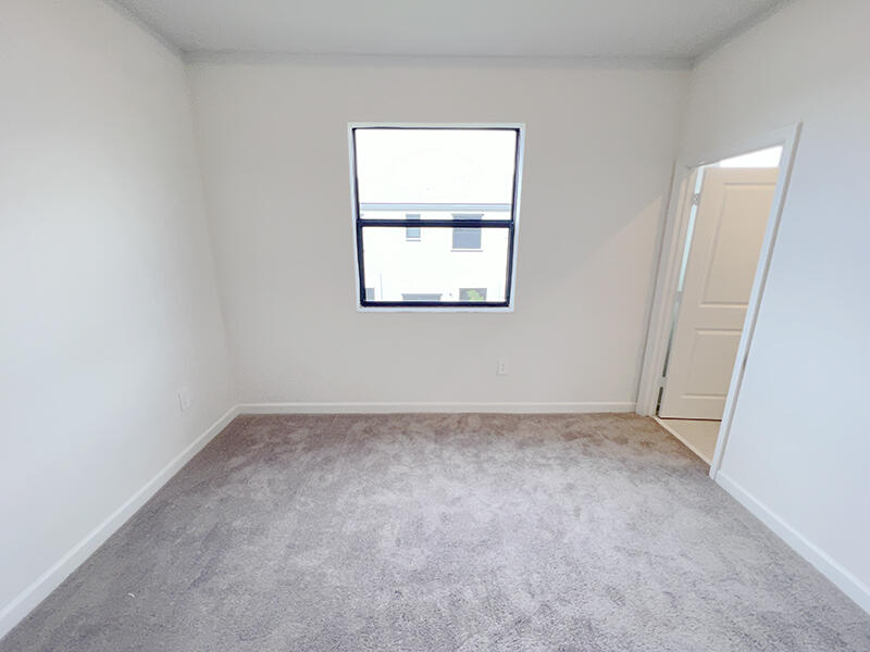 13302 Southwest 286th Street, Unit 13302 Homestead, FL 33033 - Photo 7 of 24 an empty room with a window