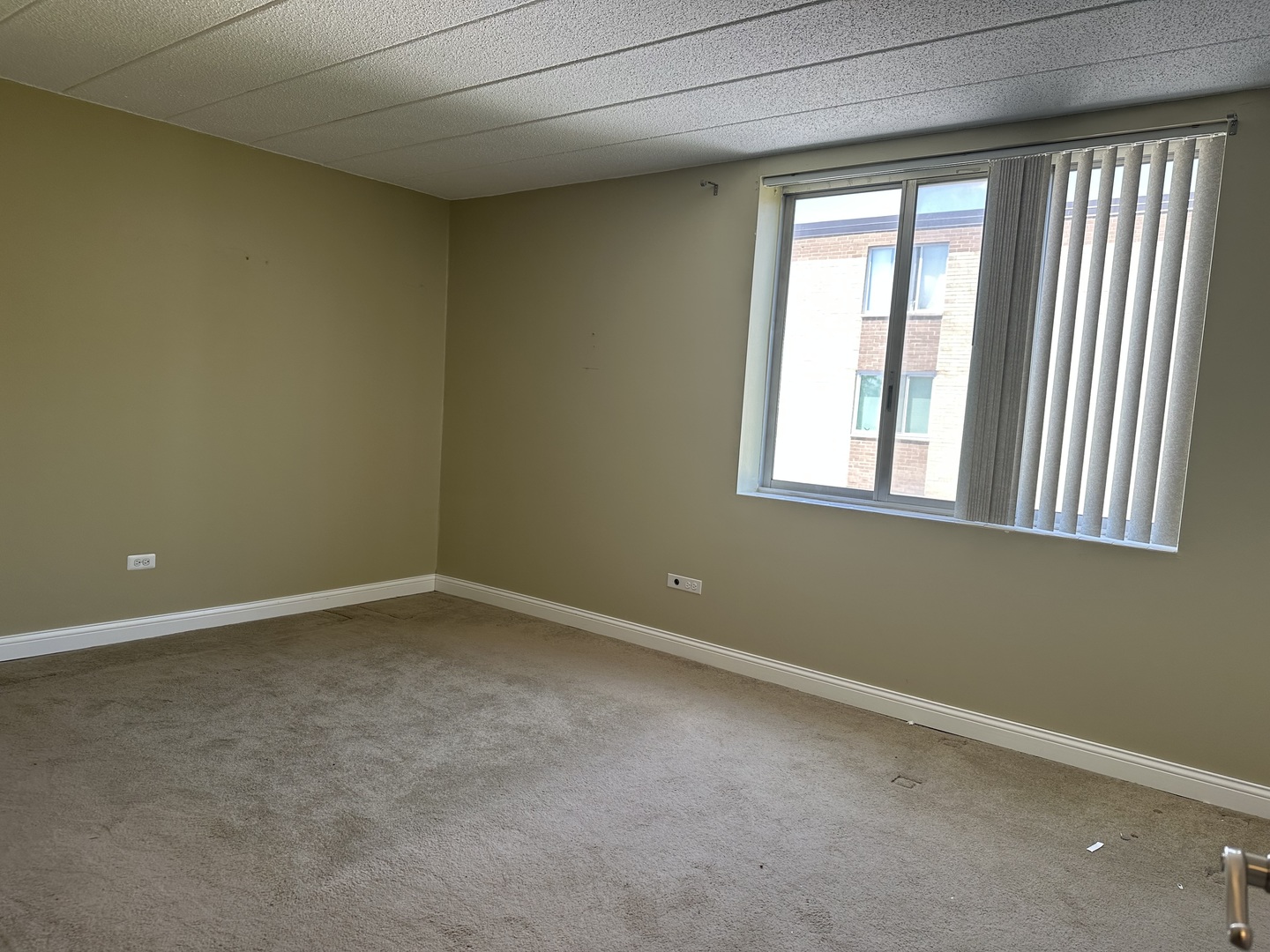 110 West Butterfield Road, Unit 402S Elmhurst, IL 60126 - Photo 6 of 17 an empty room with a window