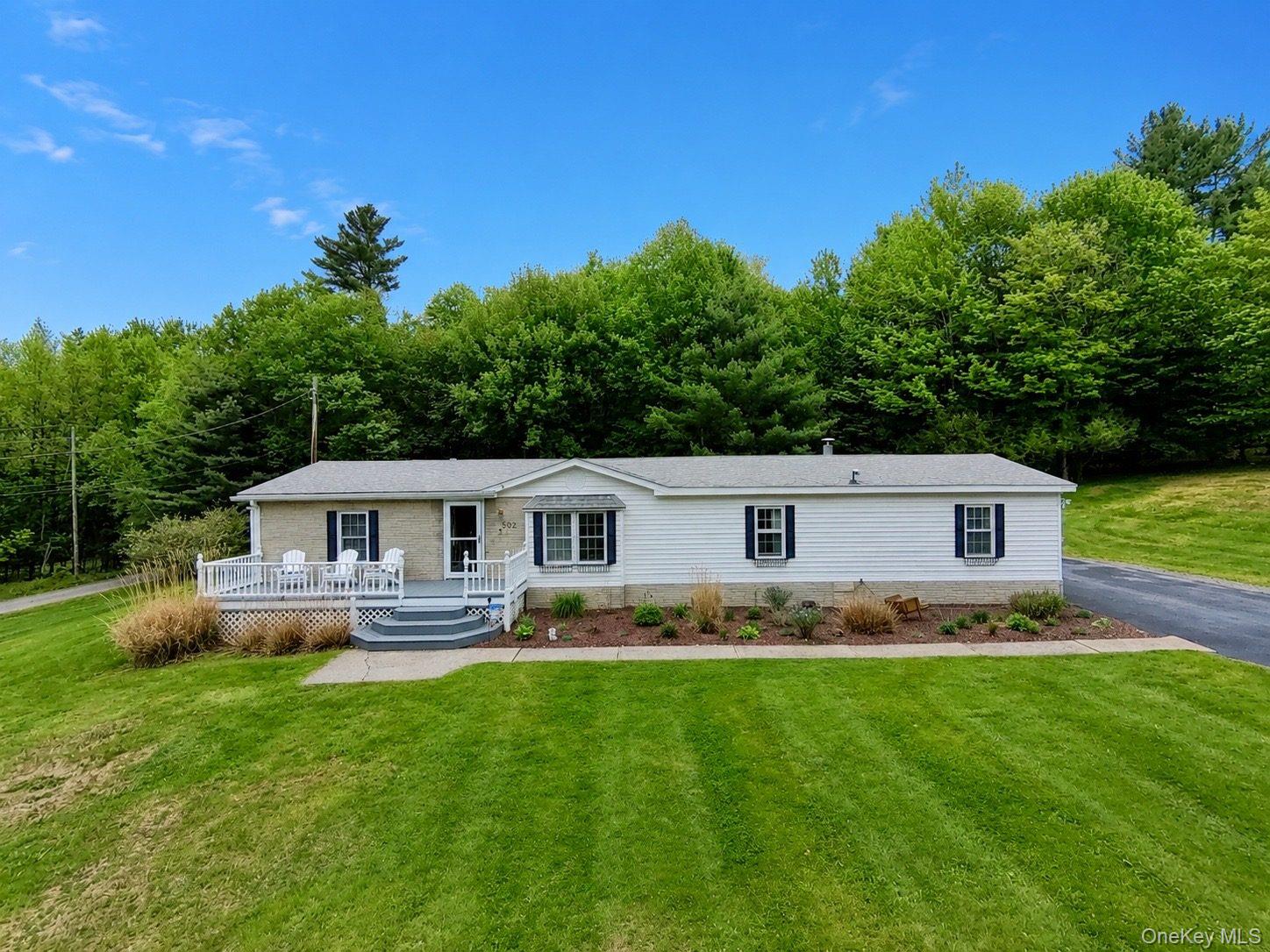 502 Myers Road Neversink, NY 12765 - Photo 2 of 38 a front view of house with yard and green space