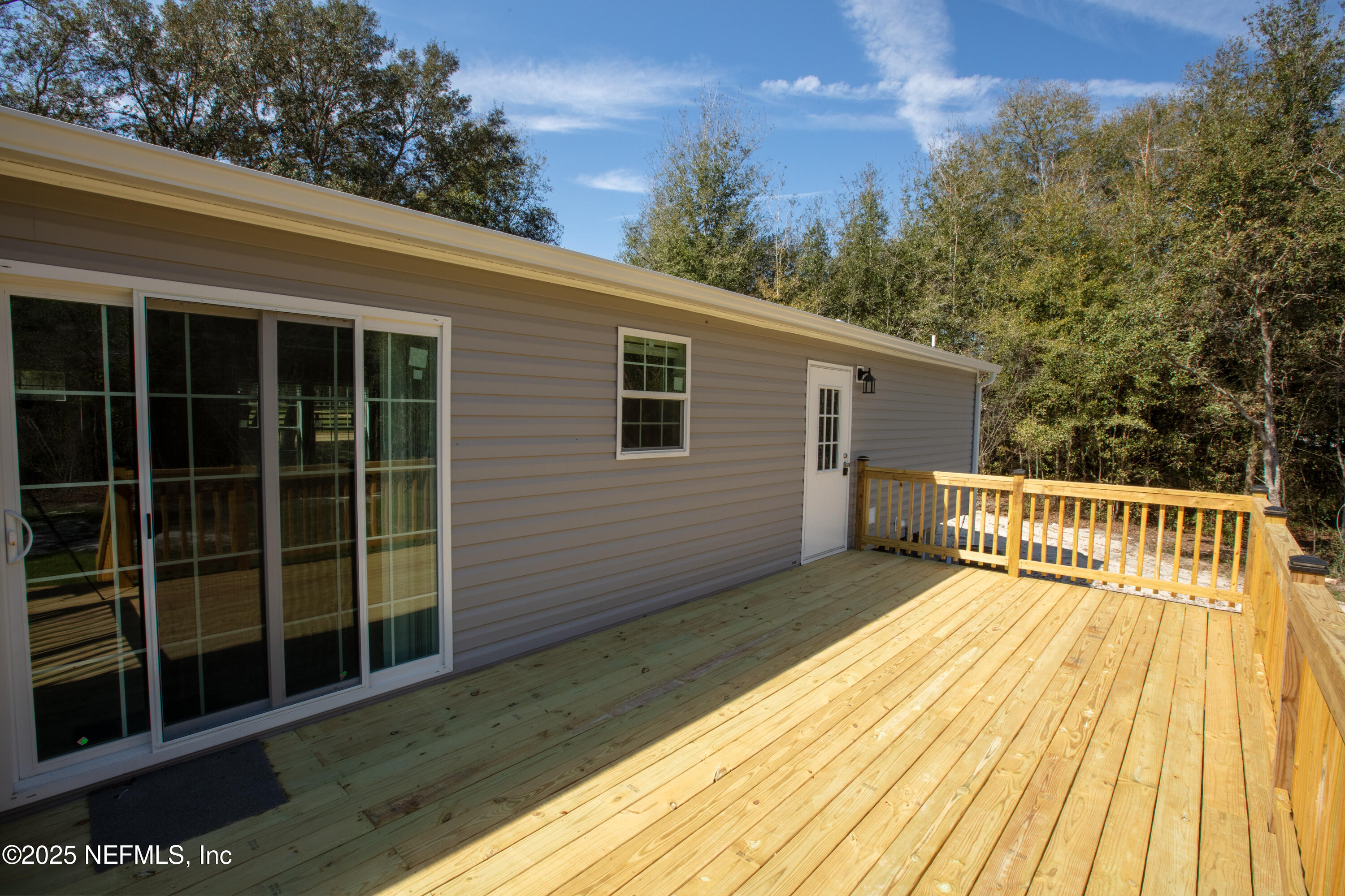 6012 Indian Trail Keystone Heights, FL 32656 - Photo 12 of 61 a view of deck with a large window