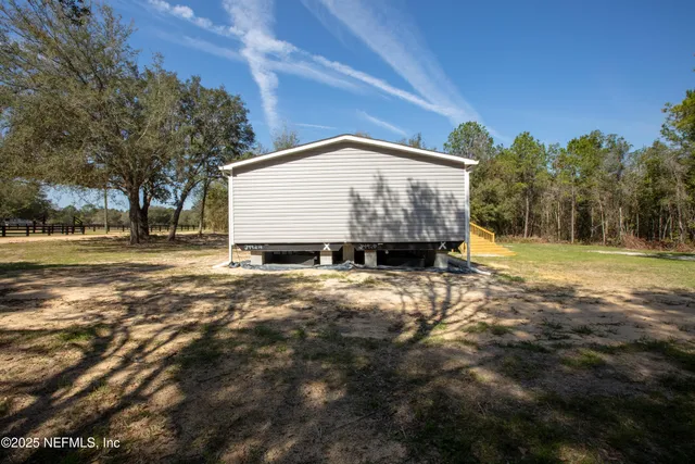 a sign board with big yard