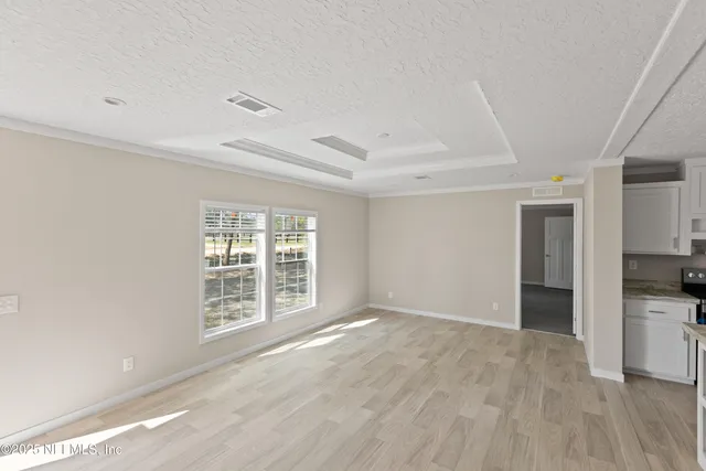 a kitchen with stainless steel appliances granite countertop a stove refrigerator sink and cabinets