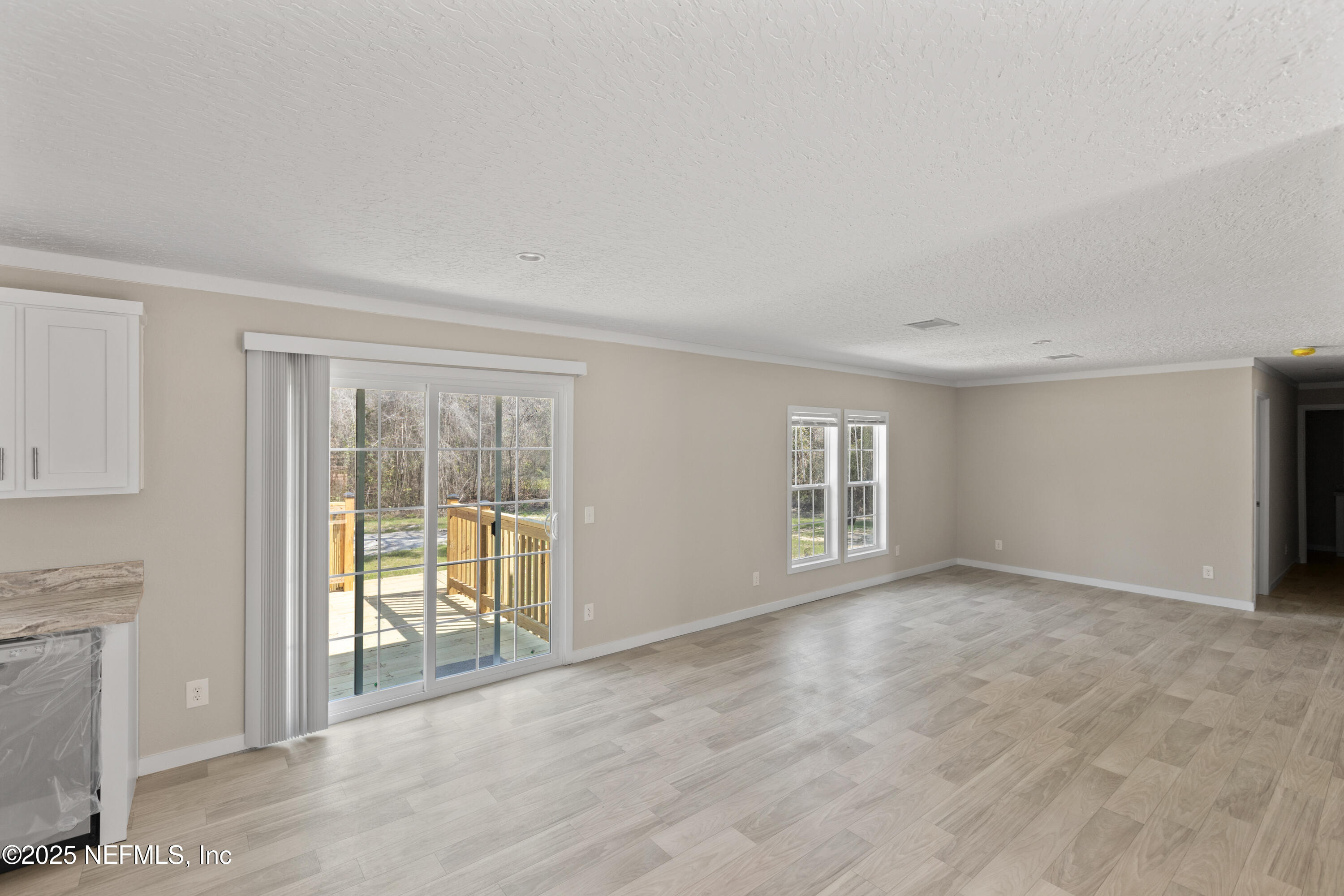 6012 Indian Trail Keystone Heights, FL 32656 - Photo 29 of 61 an empty room with windows