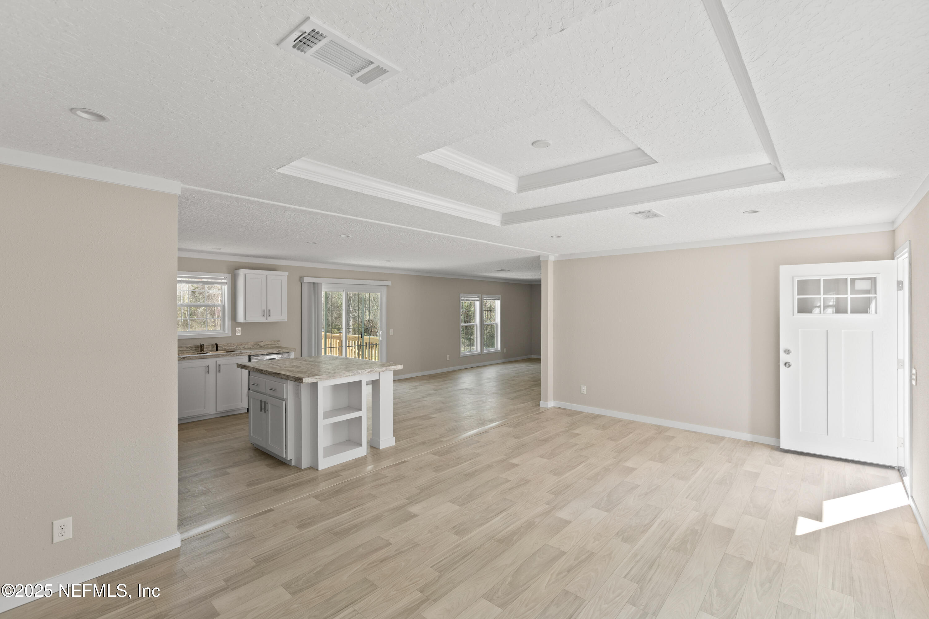 6012 Indian Trail Keystone Heights, FL 32656 - Photo 32 of 61 a view of kitchen and hall with wooden floor