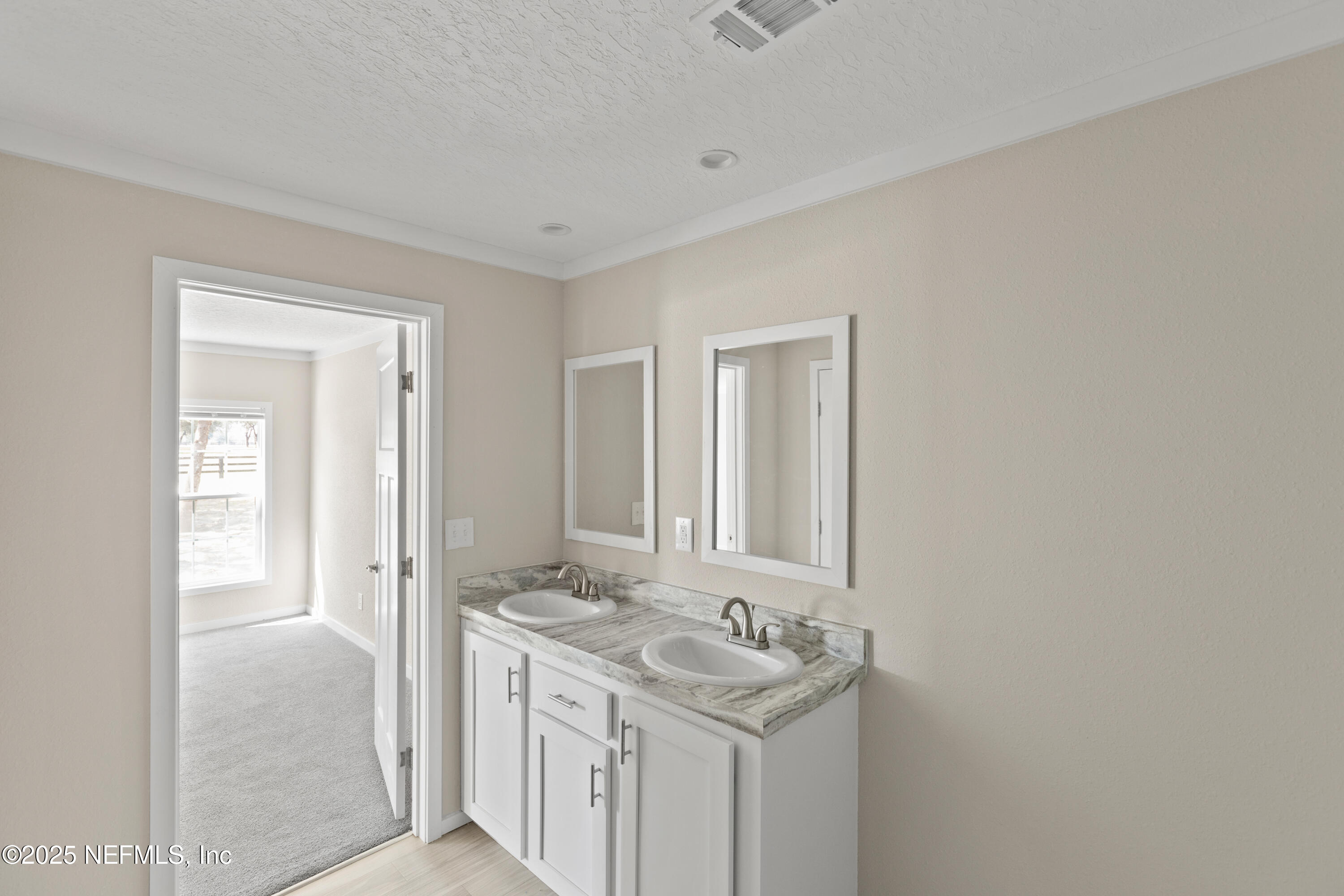 6012 Indian Trail Keystone Heights, FL 32656 - Photo 36 of 61 a bathroom with a sink and a mirror