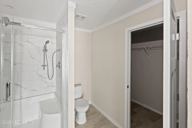 a view of empty room with closet area