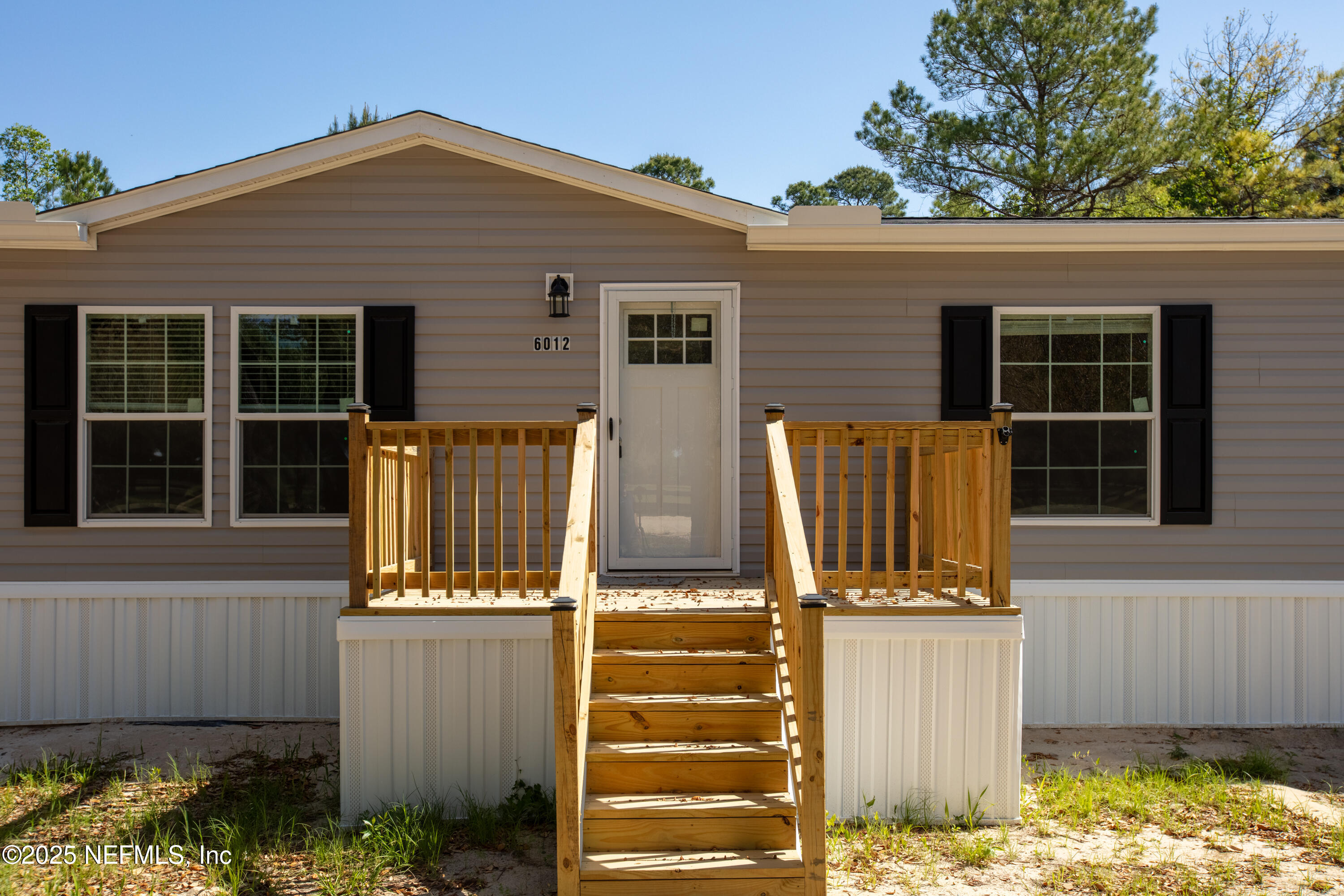 6012 Indian Trail Keystone Heights, FL 32656 - Photo 4 of 61 a view of a house with wooden fence and a window