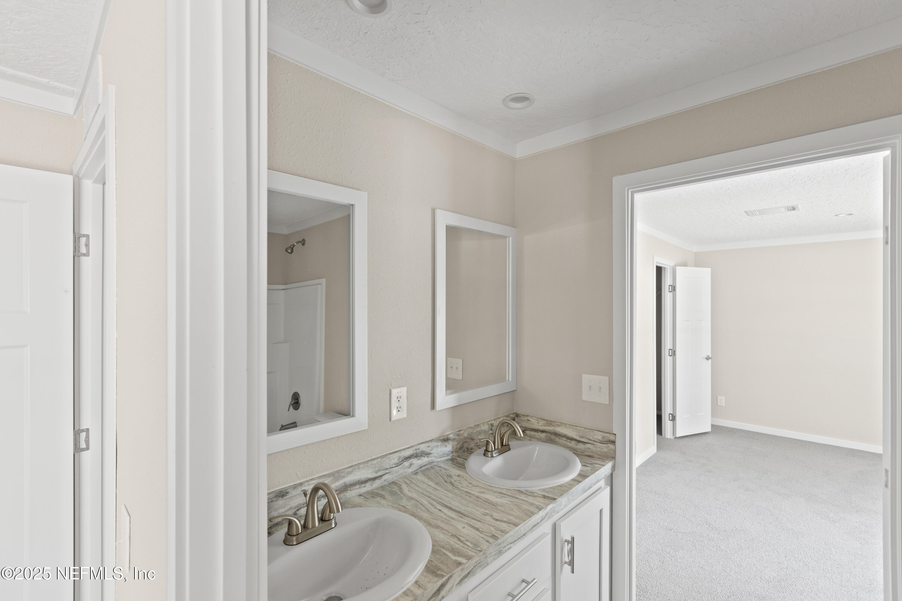 6012 Indian Trail Keystone Heights, FL 32656 - Photo 42 of 61 a bathroom with a granite countertop sink and a mirror