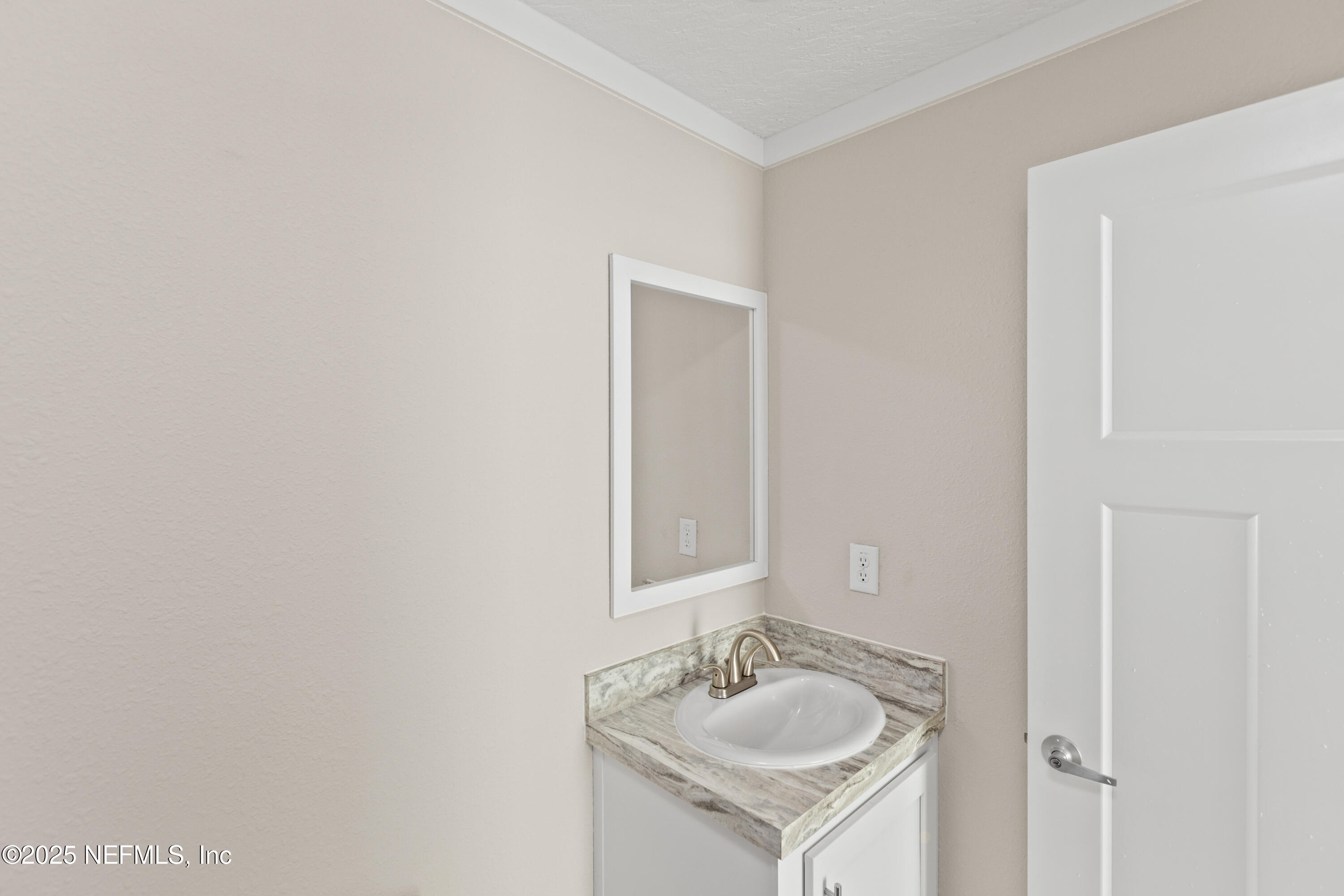 6012 Indian Trail Keystone Heights, FL 32656 - Photo 51 of 61 a bathroom with a sink and a mirror