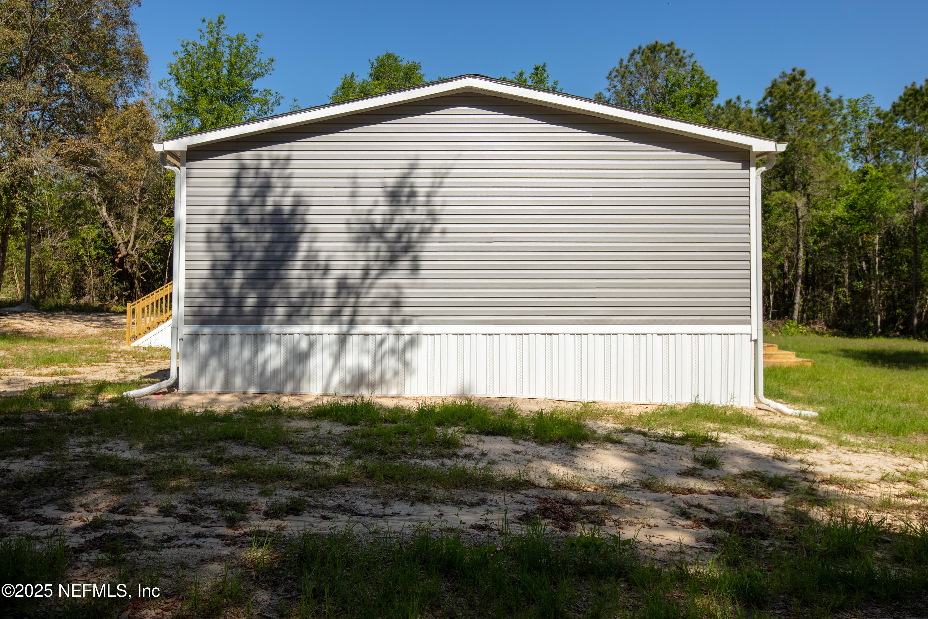 6012 Indian Trail Keystone Heights, FL 32656 - Photo 6 of 61 a view of a house with backyard and trees