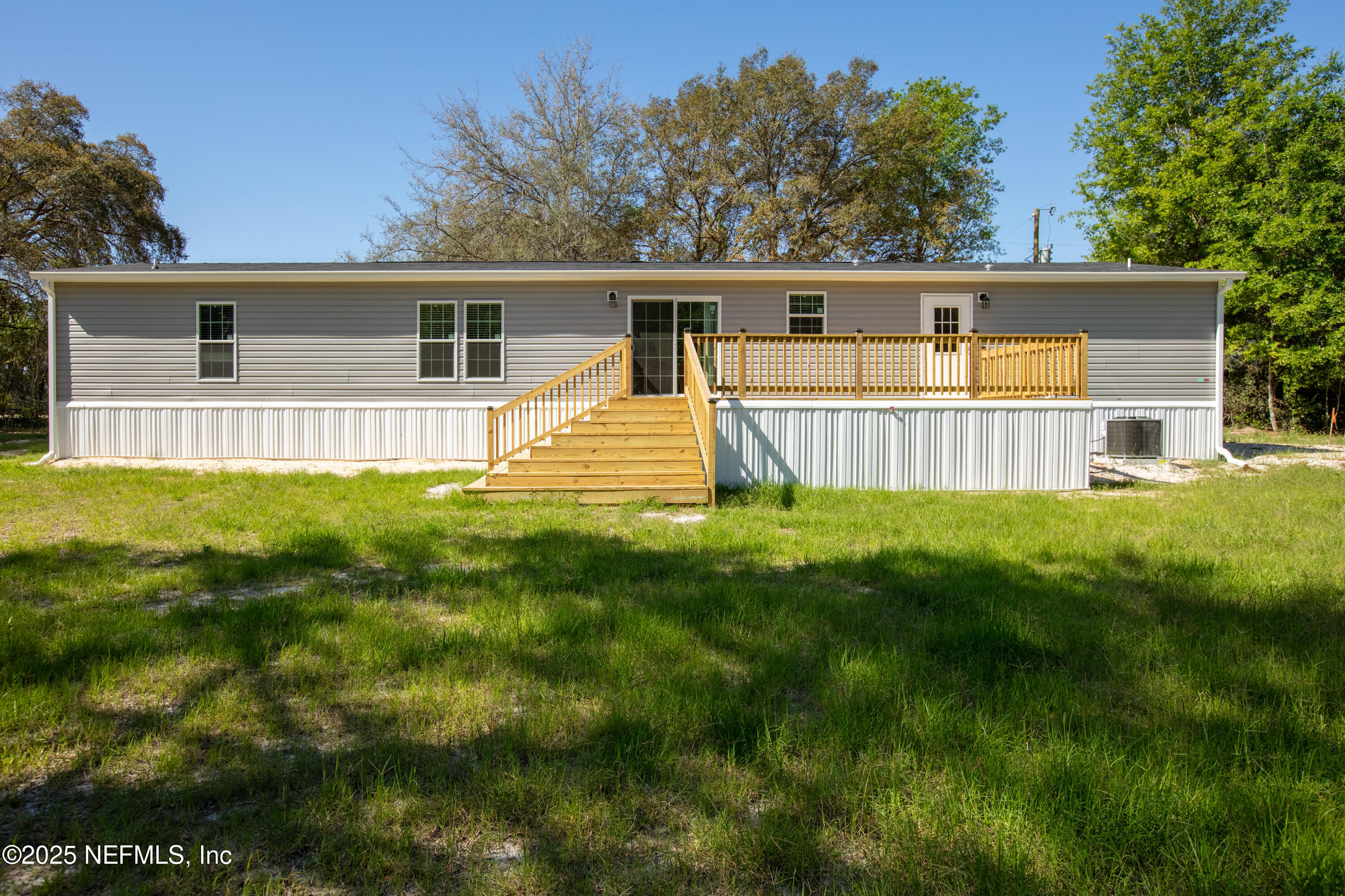 6012 Indian Trail Keystone Heights, FL 32656 - Photo 10 of 61 a front view of house with yard and green space