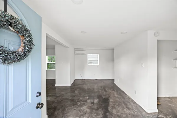 an empty room with a hallway