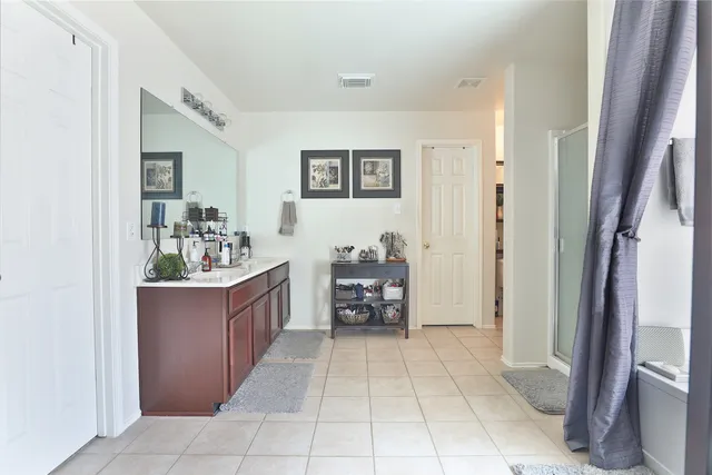 a room with kitchen island table and chairs