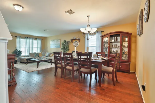 a view of a dining room with furniture window and wooden floor