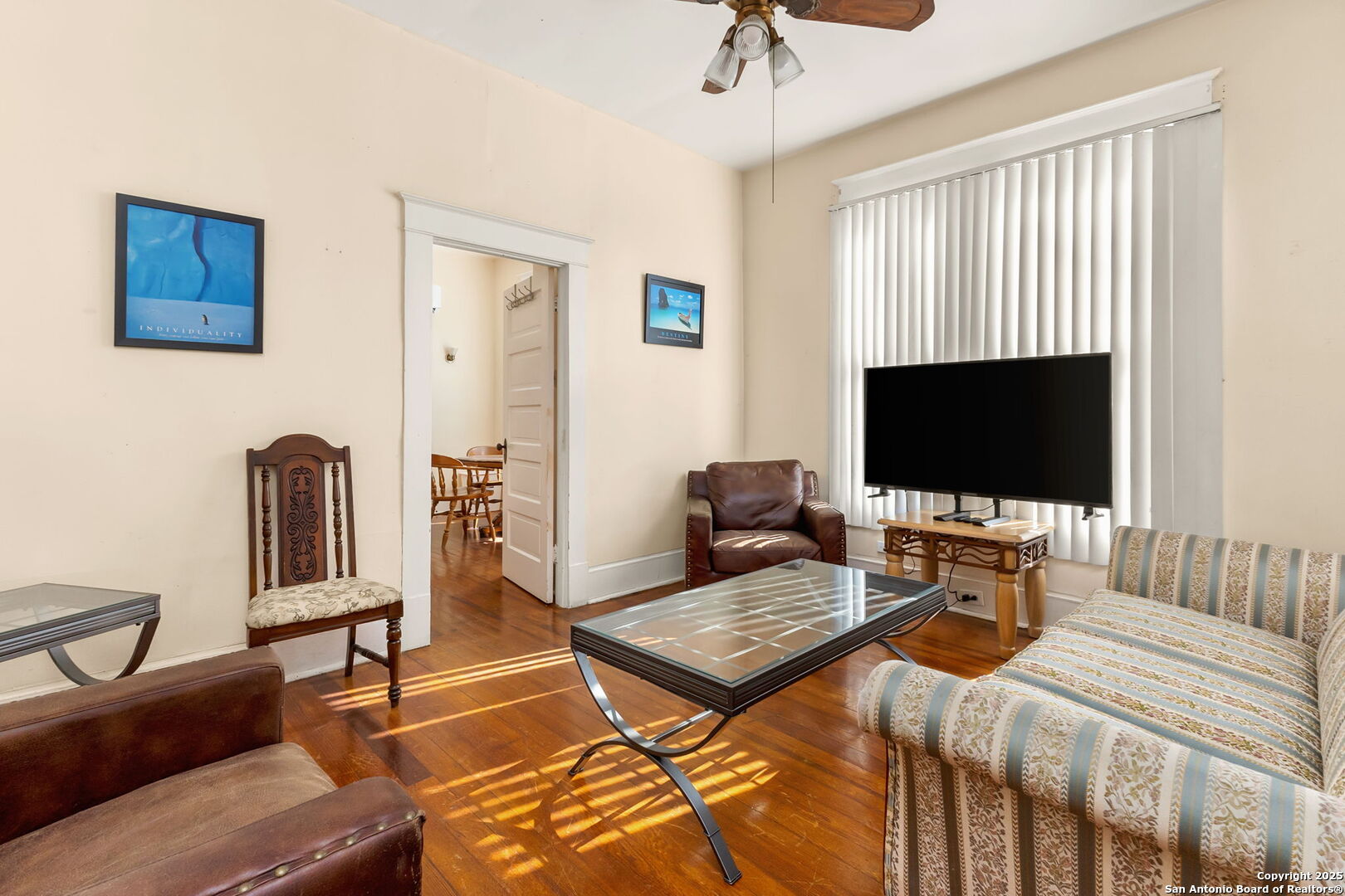 333 Florida Street San Antonio, TX 78210 - Photo 18 of 34 a bedroom with a bed and a flat screen tv