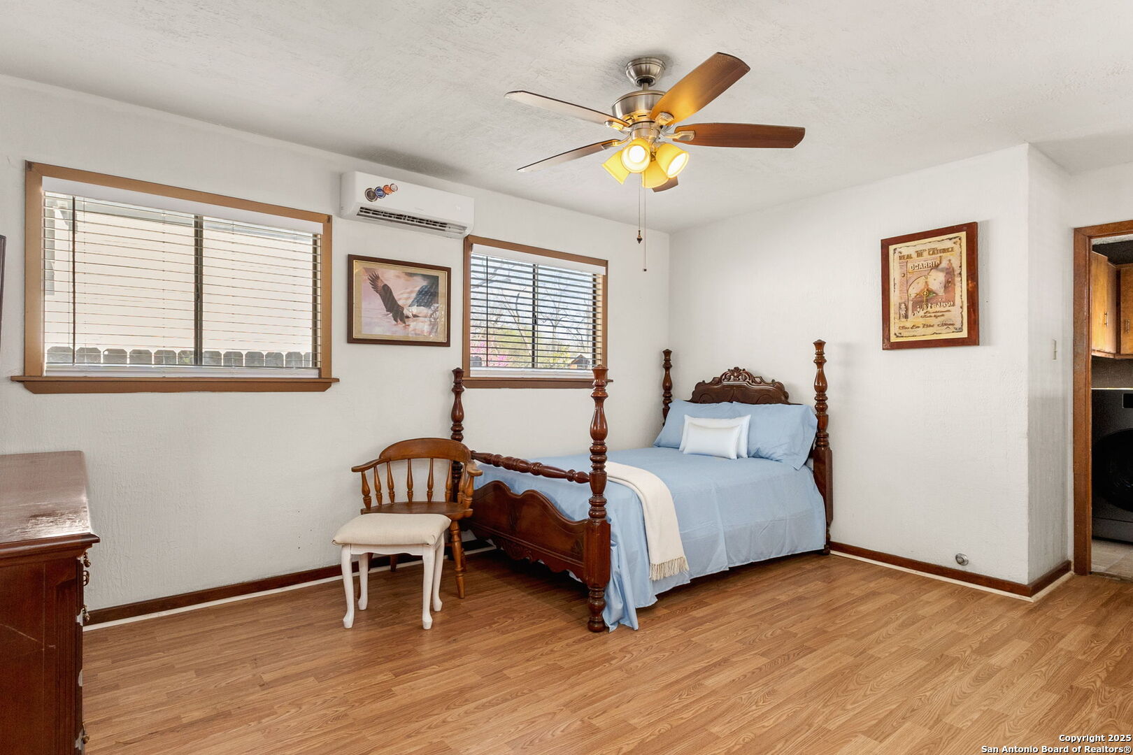 333 Florida Street San Antonio, TX 78210 - Photo 24 of 34 a bedroom with a bed and a chandelier