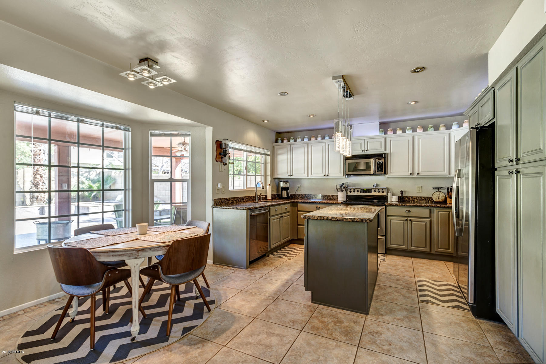 Kitchen w/ two tone wood cabinets