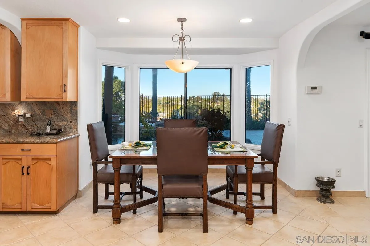 445 Via Savoy Encinitas, CA 92024 - Photo 12 of 39 a view of a dining room with furniture window and outside view