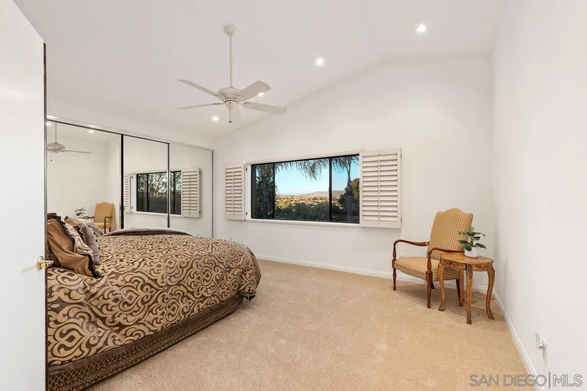 445 Via Savoy Encinitas, CA 92024 - Photo 16 of 39 a living room with furniture and a large window