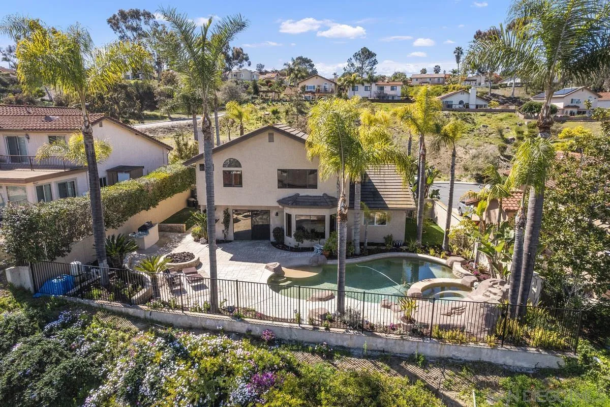 445 Via Savoy Encinitas, CA 92024 - Photo 34 of 39 a view of a house with a yard and fountain in middle of the house