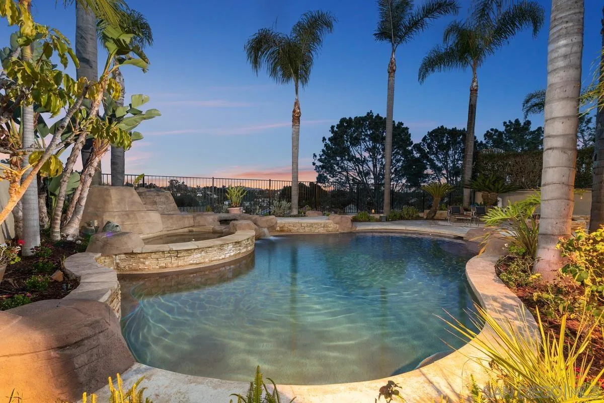 445 Via Savoy Encinitas, CA 92024 - Photo 6 of 39 a view of a swimming pool with a table and chairs