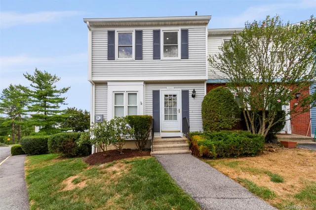 a house view with a garden space