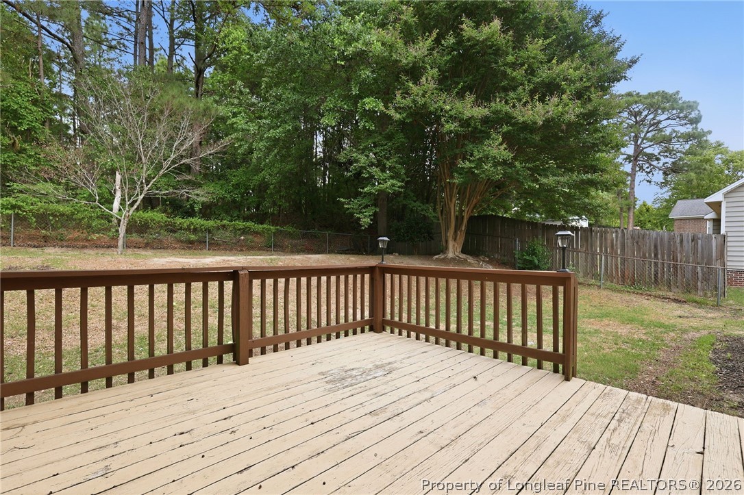 5113 Archer Road Hope Mills, NC 28348 - Photo 37 of 41 a view of balcony with wooden floor and fence
