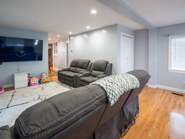 a living room with a couch and a flat screen tv