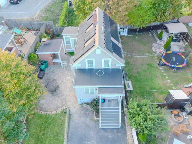 an aerial view of a house with outdoor space