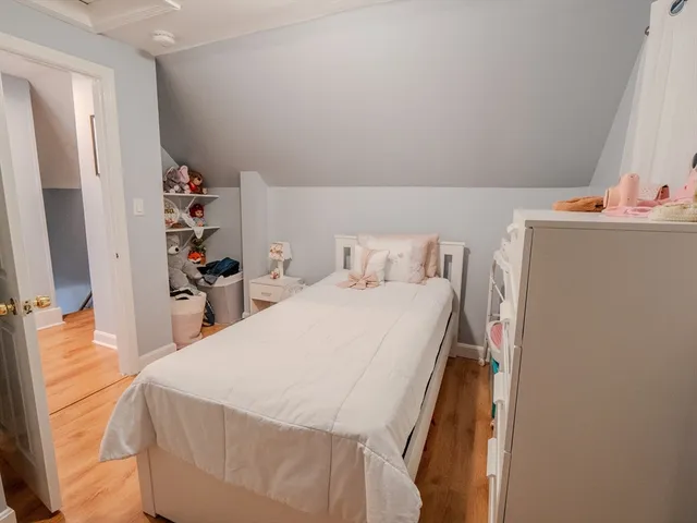 a bedroom with a bed and a closet