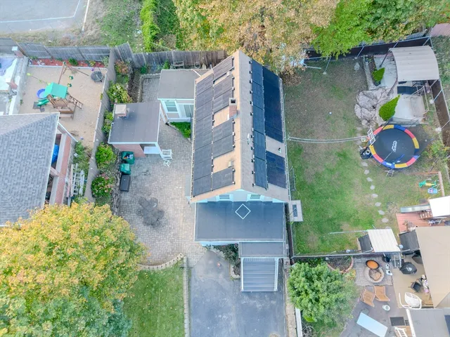 an aerial view of houses with yard