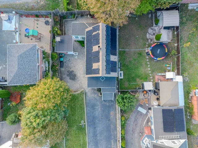an aerial view of multiple house with outdoor space