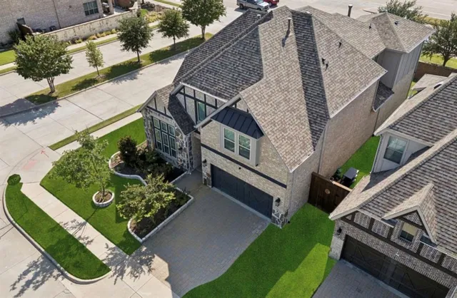 a view of a backyard with sitting area