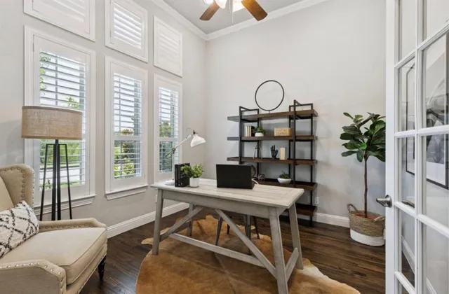a view of a livingroom with furniture window and wooden floor