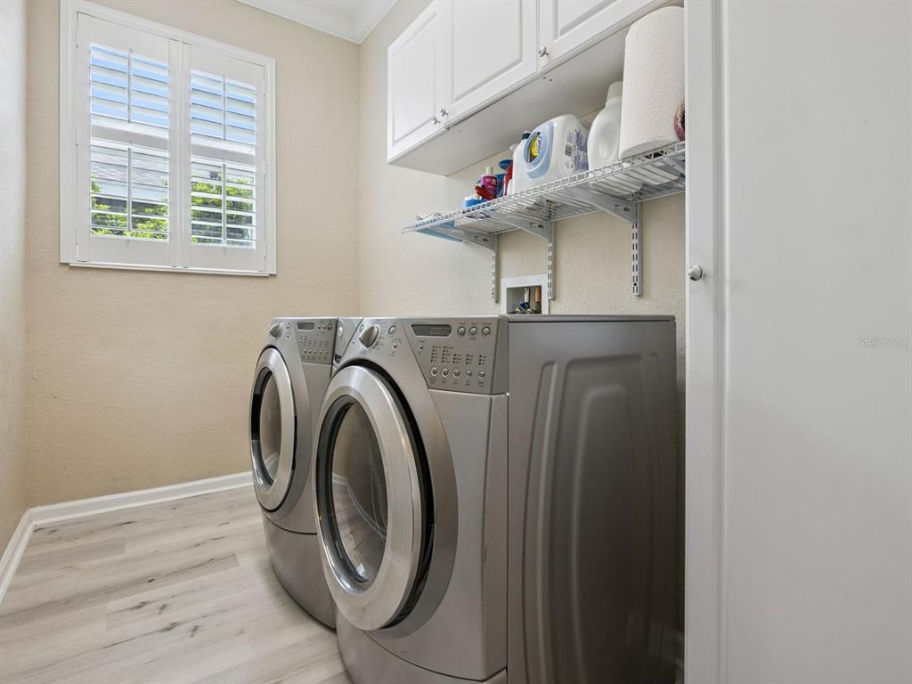 13403 Riggs Way Windermere, FL 34786 - Photo 26 of 47 a view of washer and dryer sitting on a table